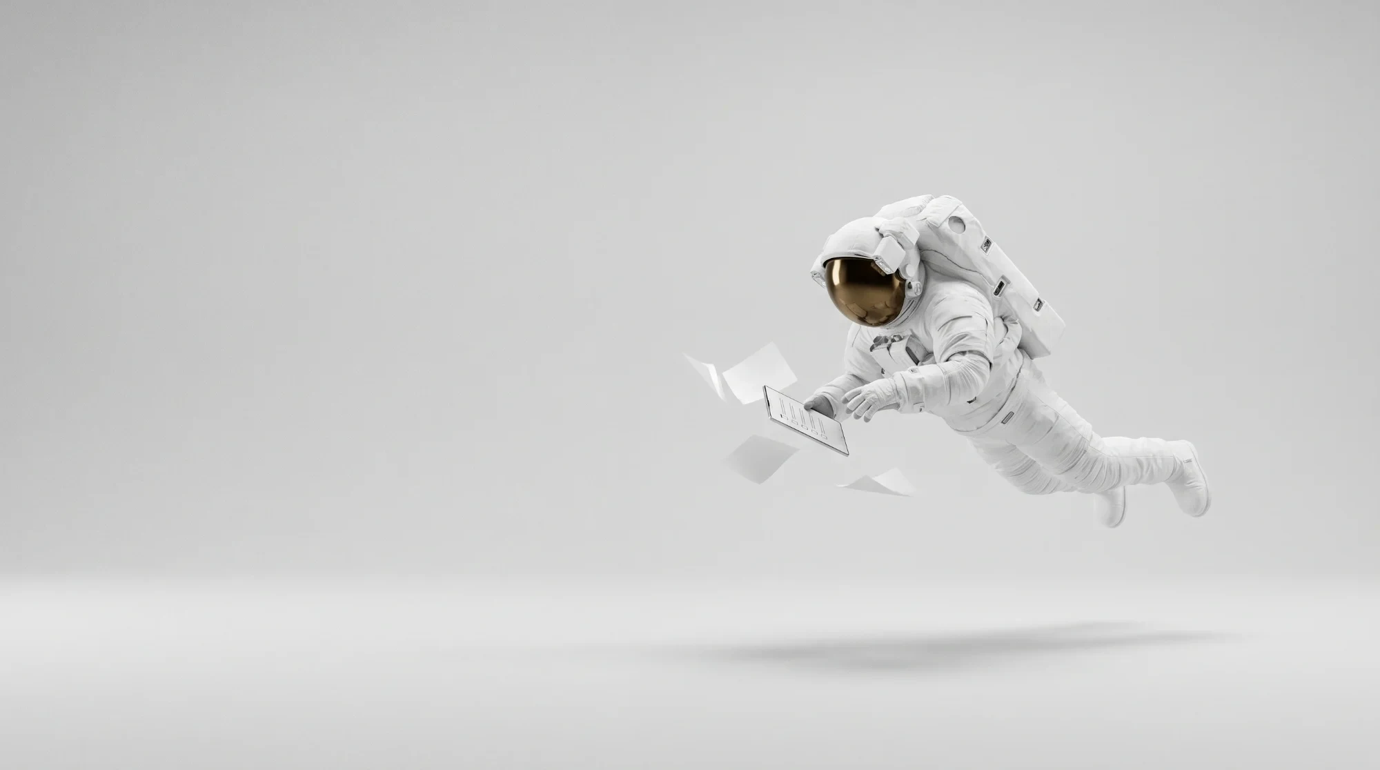 Astronaut reading a brief while floating in a grey studio